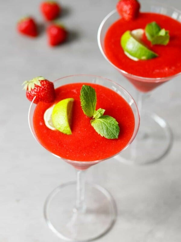 A martini glass with frozen strawberry daiquiri