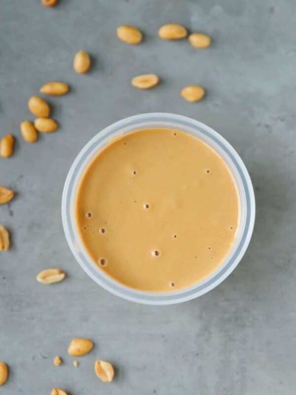 Homemade peanut butter in a clear plastic container