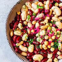 Three bean salad with kidney beans, cannellini, and chickpeas tossed in olive oil and vinegar dressing