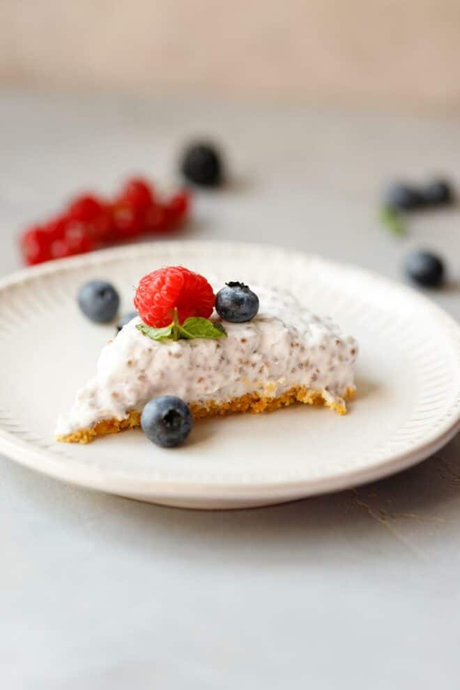 A slice of chia cheesecake on a white plate