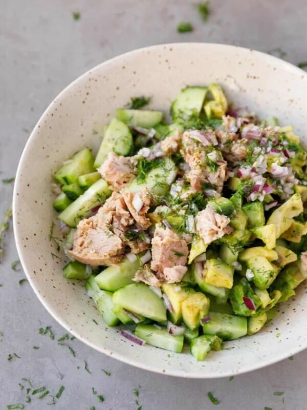 A bowl with avocado tuna cucumber salad