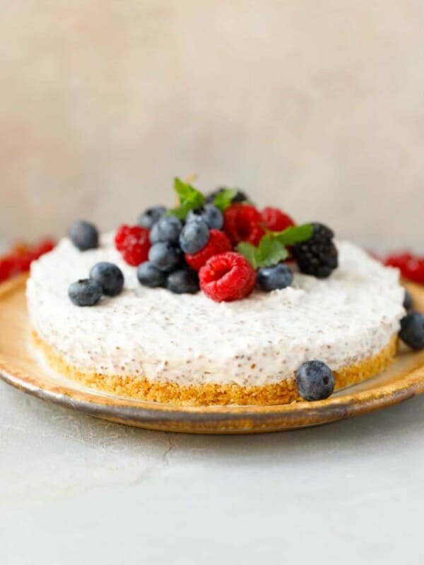 Chia cheesecake topped with berries on a plate