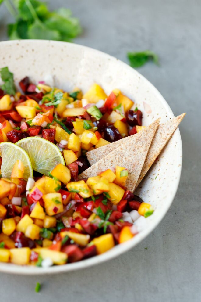 Nectarine salsa with chips in a bowl