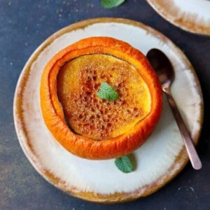 Keto pumpkin creme brulee inside a sugar pumpkin