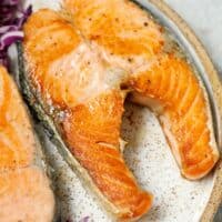 Salmon steaks on a speckled plate