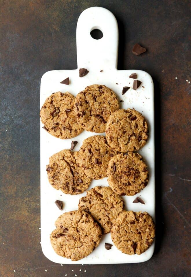 Chocolate chip tahini cookies on a board