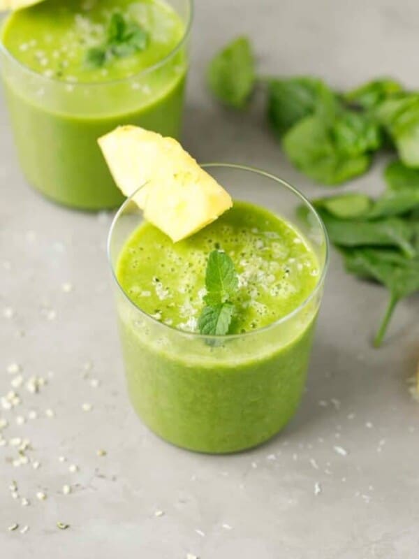 Pineapple spinach smoothie in a small glass