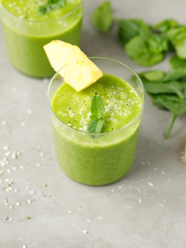 Pineapple spinach smoothie in a small glass