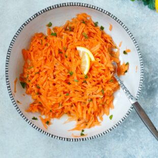 Ceramic bowl with grated carrot salad