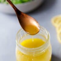 A jar with lemon vinaigrette