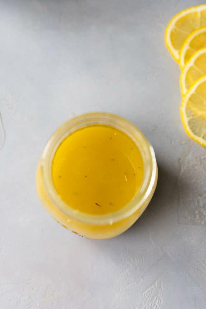 Lemon juice salad dressing in a clear glass jar