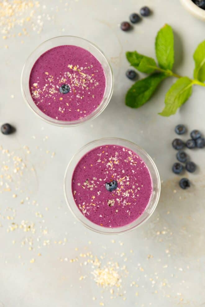 Two glassed with purple cottage cheese smoothie
