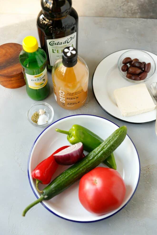 Ingredients needed for Greek salad on a table