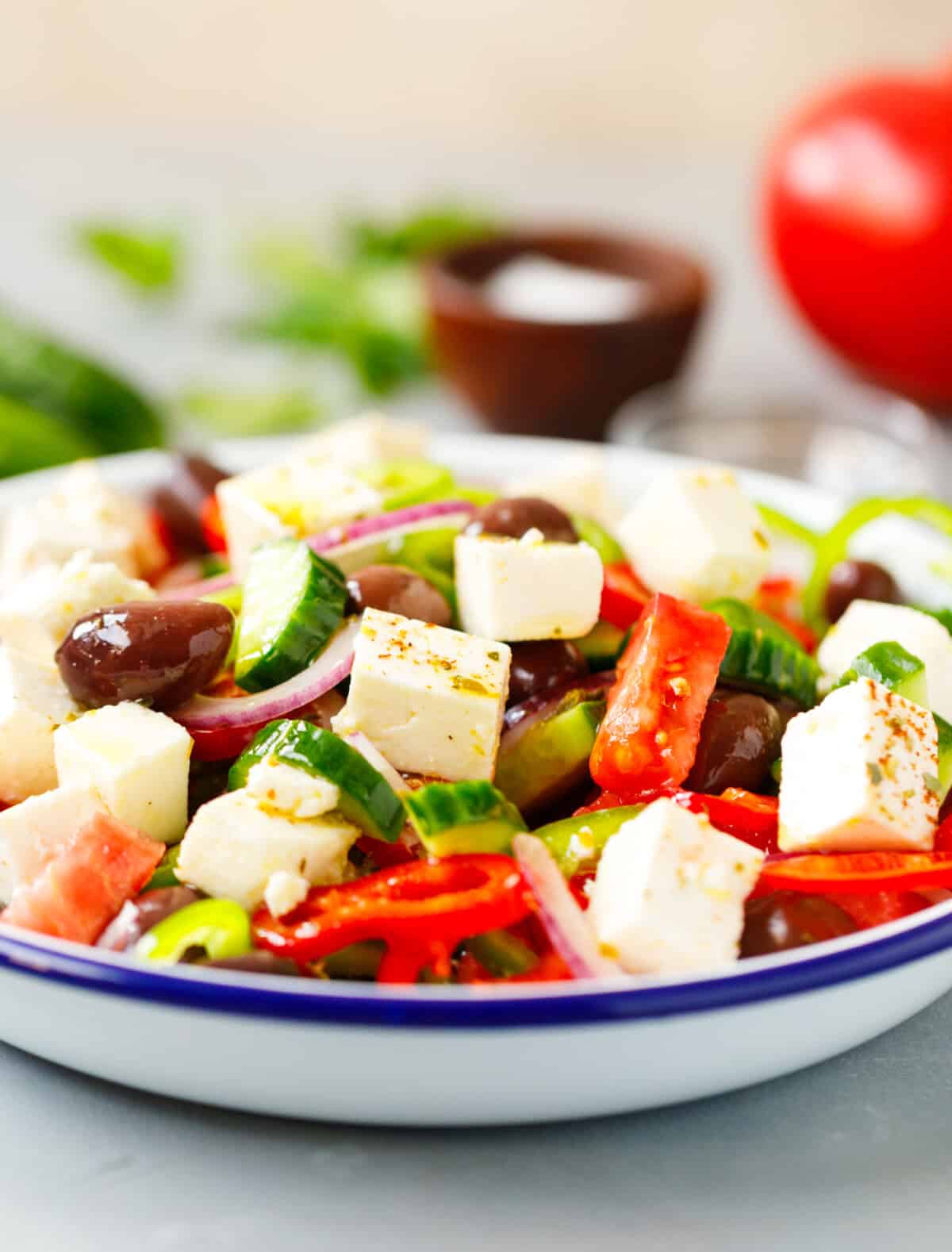 Greek salad with feta cheese olives cucumber tomato and onion in Mediterranean salad bowl