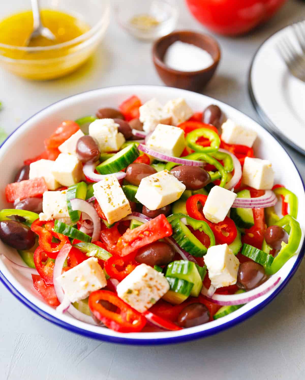 `a bowl with fresh homemade and inexpensive tomato, cucumber, pepper, onion Greek salad