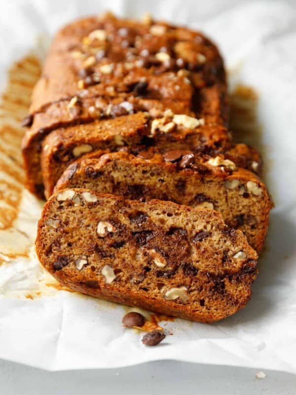 Sliced vegan banana bread on parchment paper