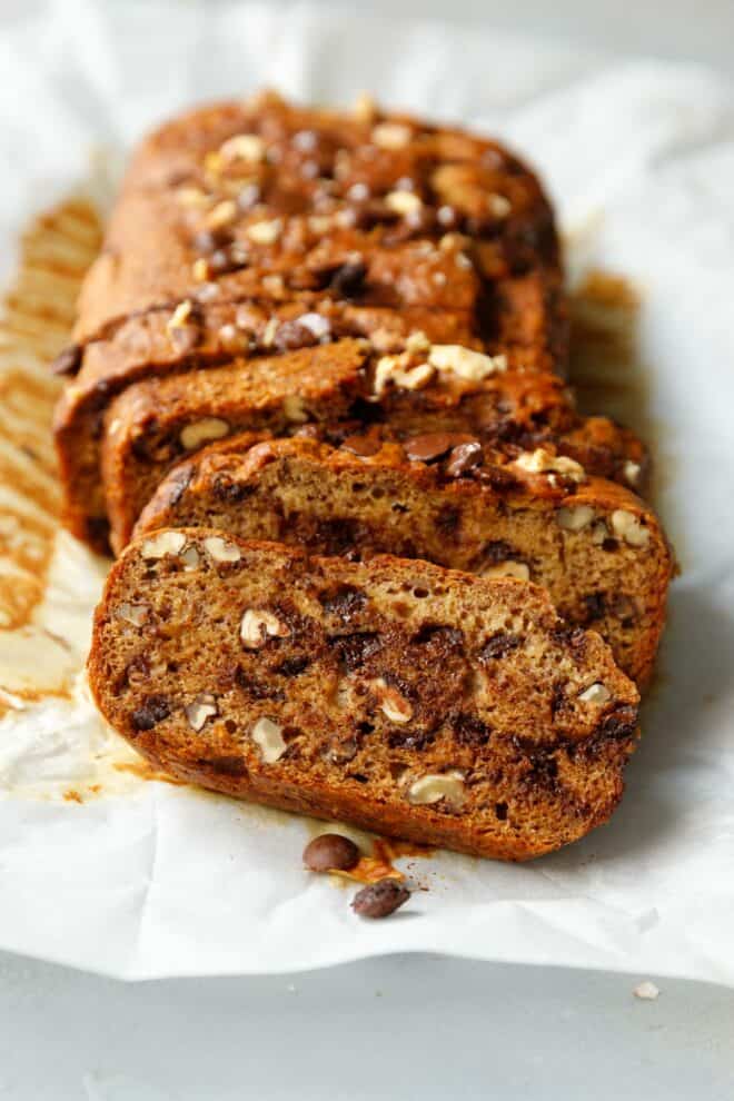 Sliced vegan banana bread on parchment paper