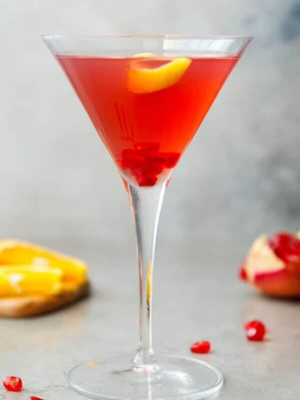 A martini glass with pomegranate martini