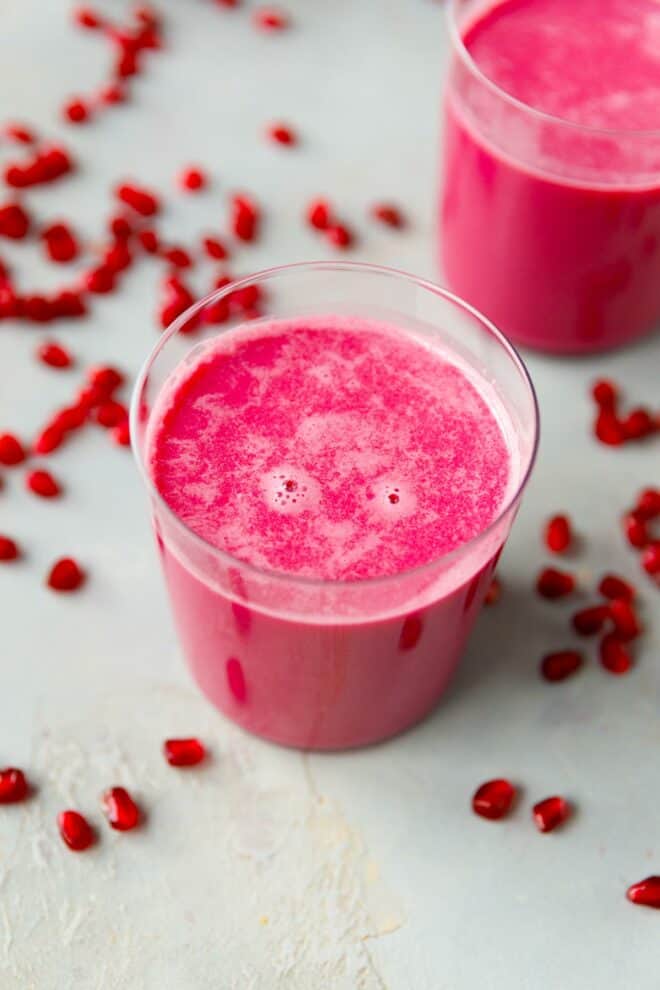 Two glasses with colorful homemade pomegranate juice