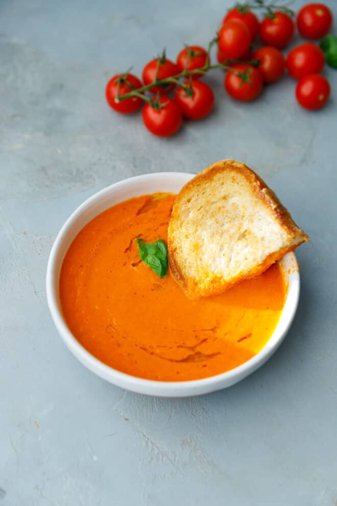 A bowl with roasted cherry tomato soup