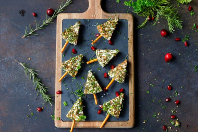 Cheese wedge Christmas trees on a stone cutting board