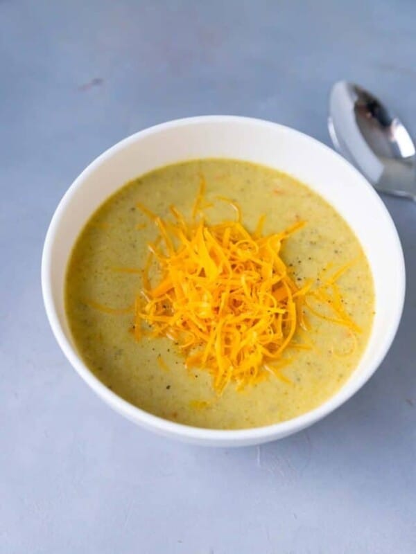 White bowl with cheddar broccoli instant pot soup