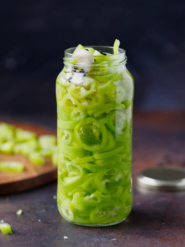 A jar with pickled banana peppers