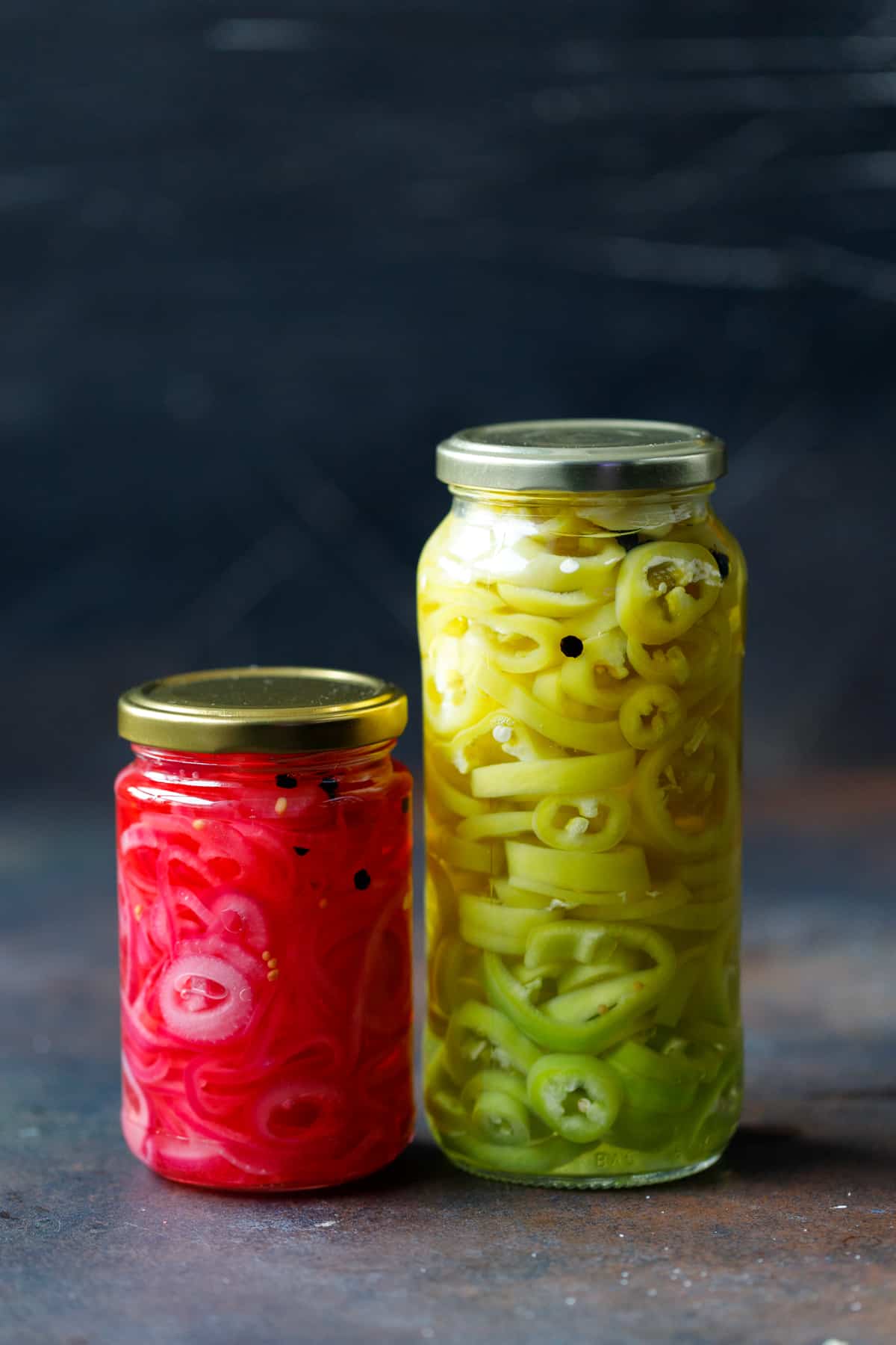 2 jars with pickled banana peppers and pickled onions
