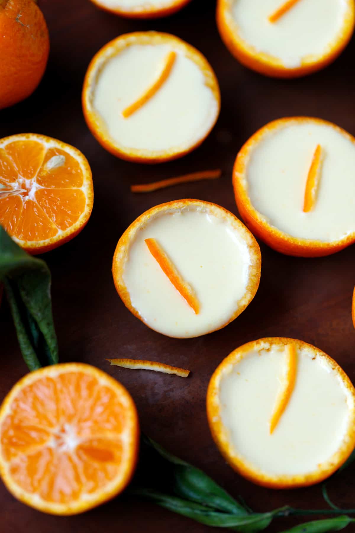 Tangerine shells filled with luscious tangerine posset