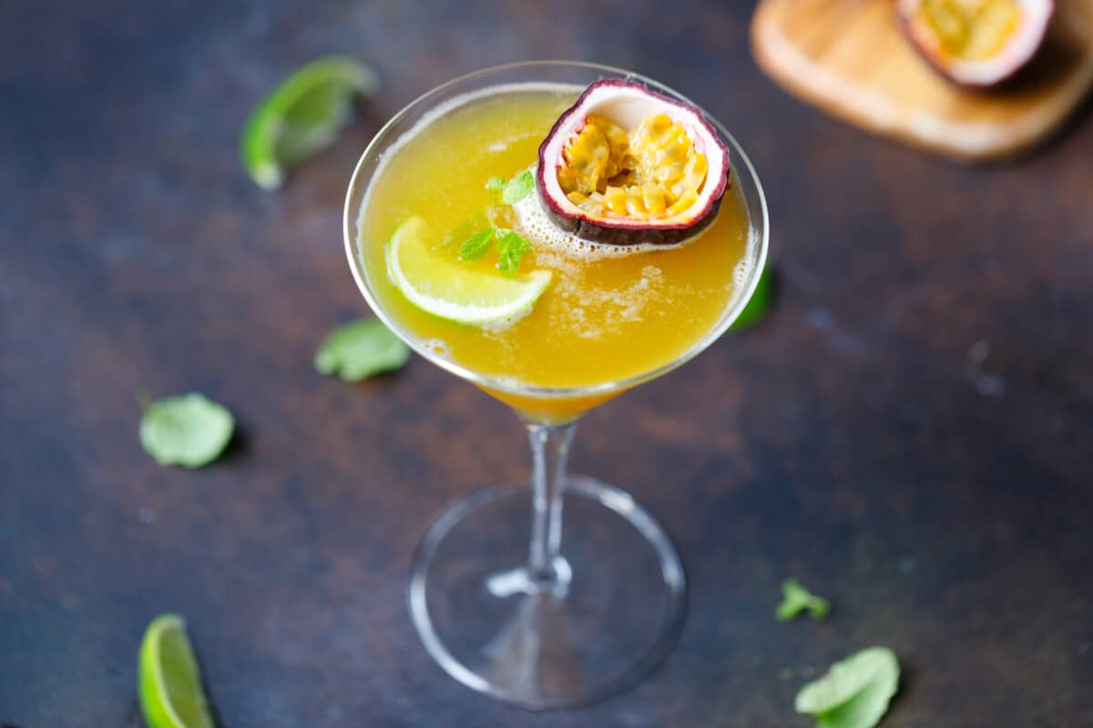 A cocktail glass filled with passion fruit martini (cocktail)