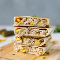 Tuna Wraps on a cutting board made with tortillas and canned tuna