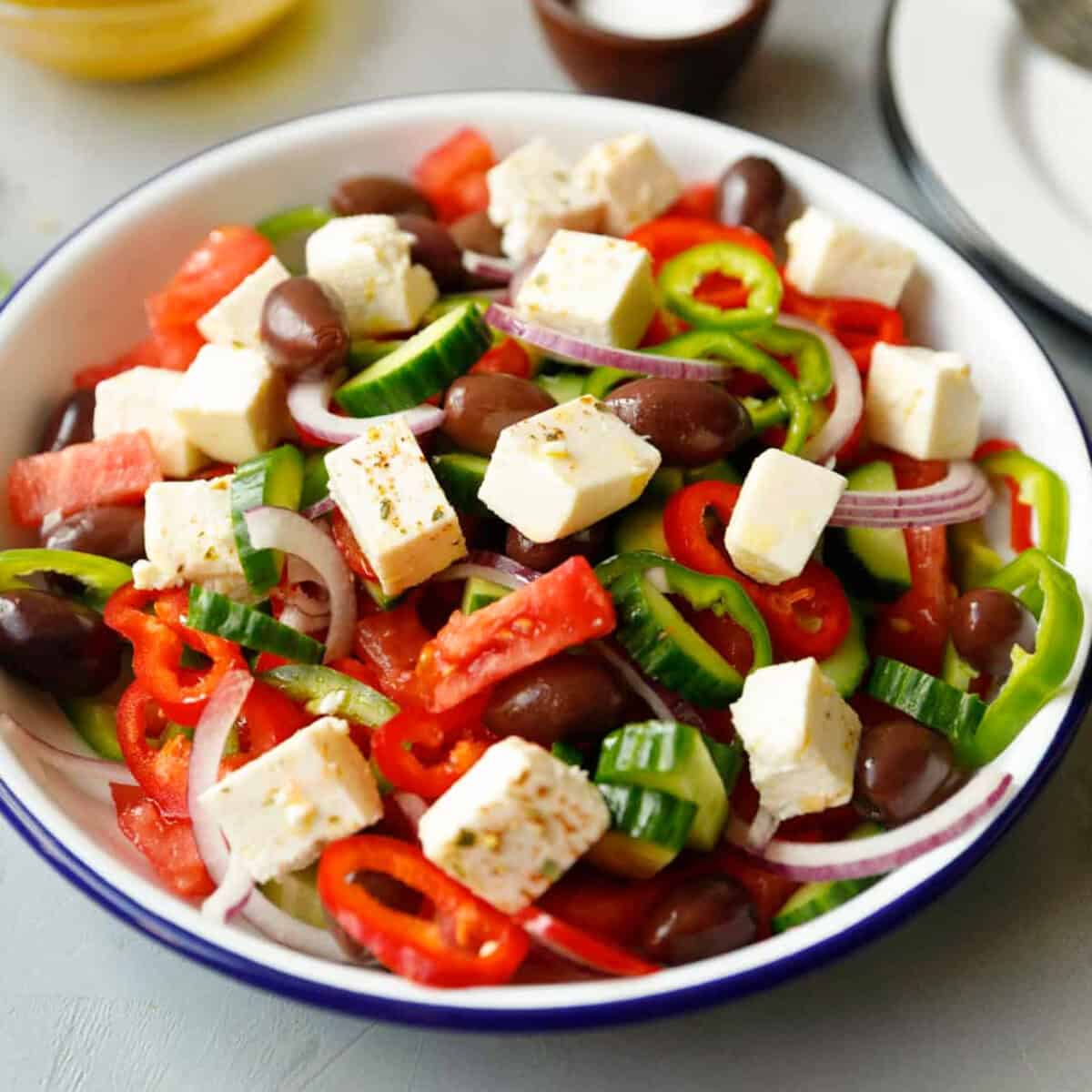 Greek salad in a white bowl