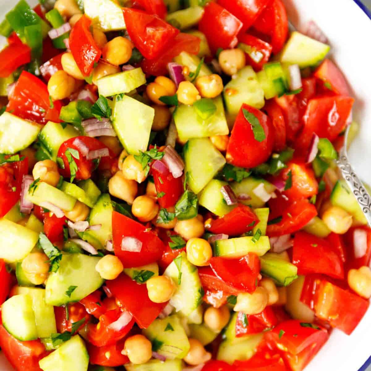 Tomato cucumber chickpea salad in a bowl