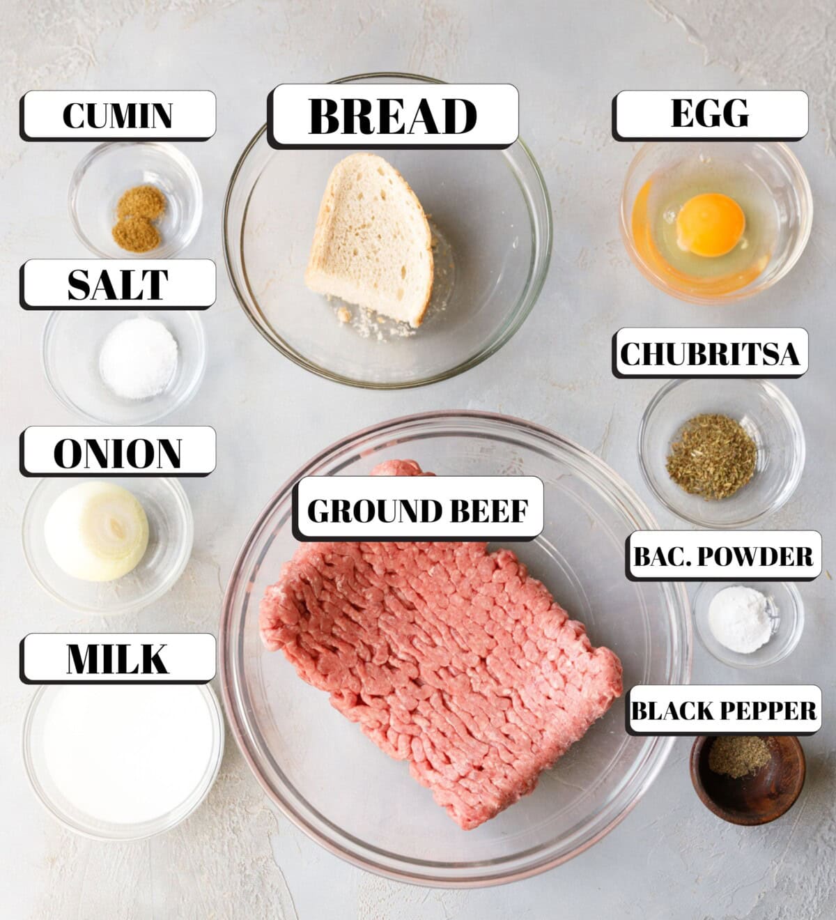 Clear bowls with ingredients needed to make fried beef meatballs