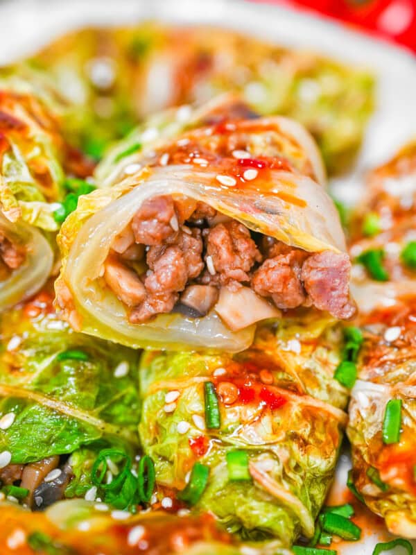 Close-up of cabbage roll cut in half to reveal the juicy meat and mushroom filling inside.