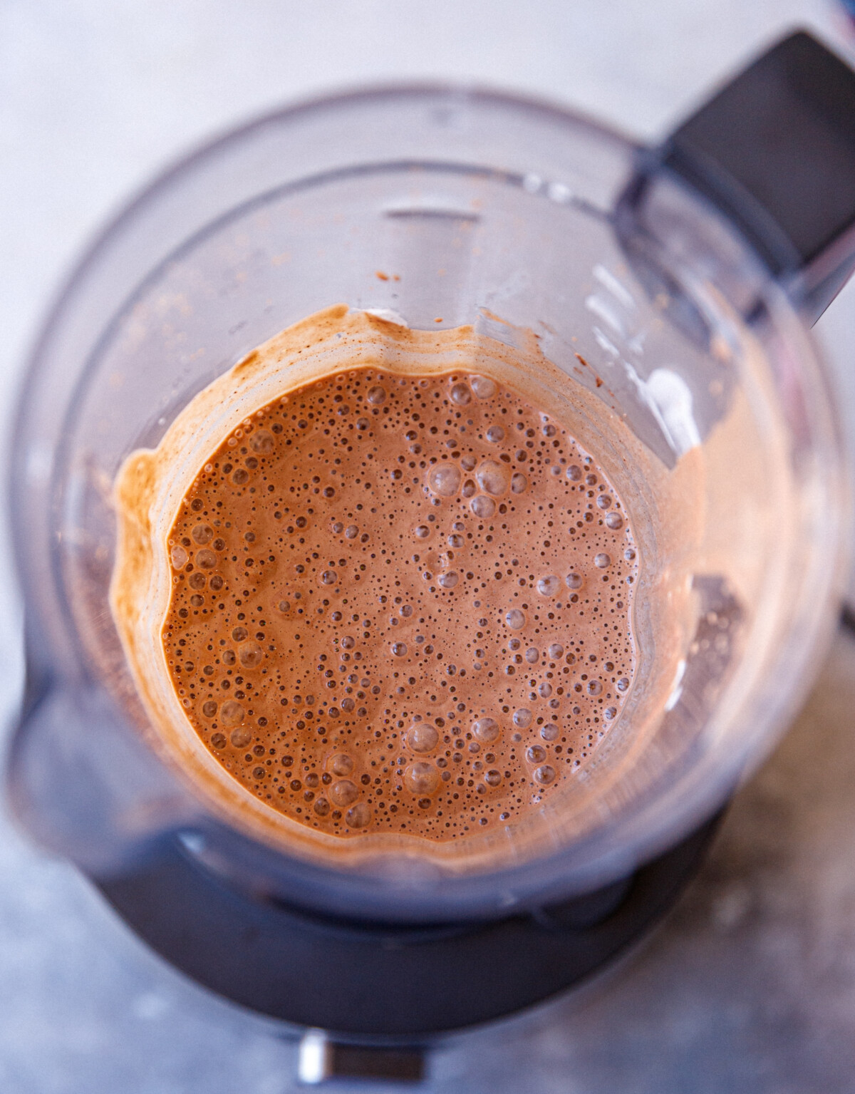 A Phillips blender with mixture fir chocolate cottage cheesecake.