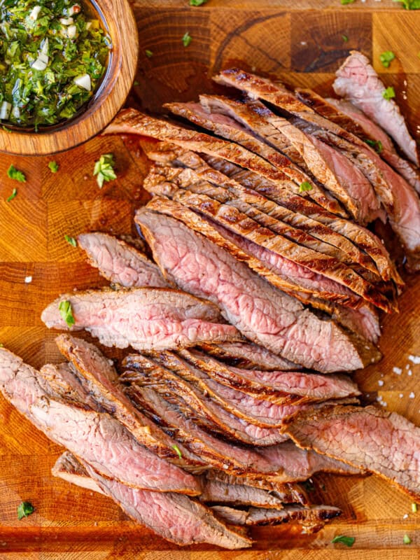 Sliced pink on the inside bavette steak on a cutting board