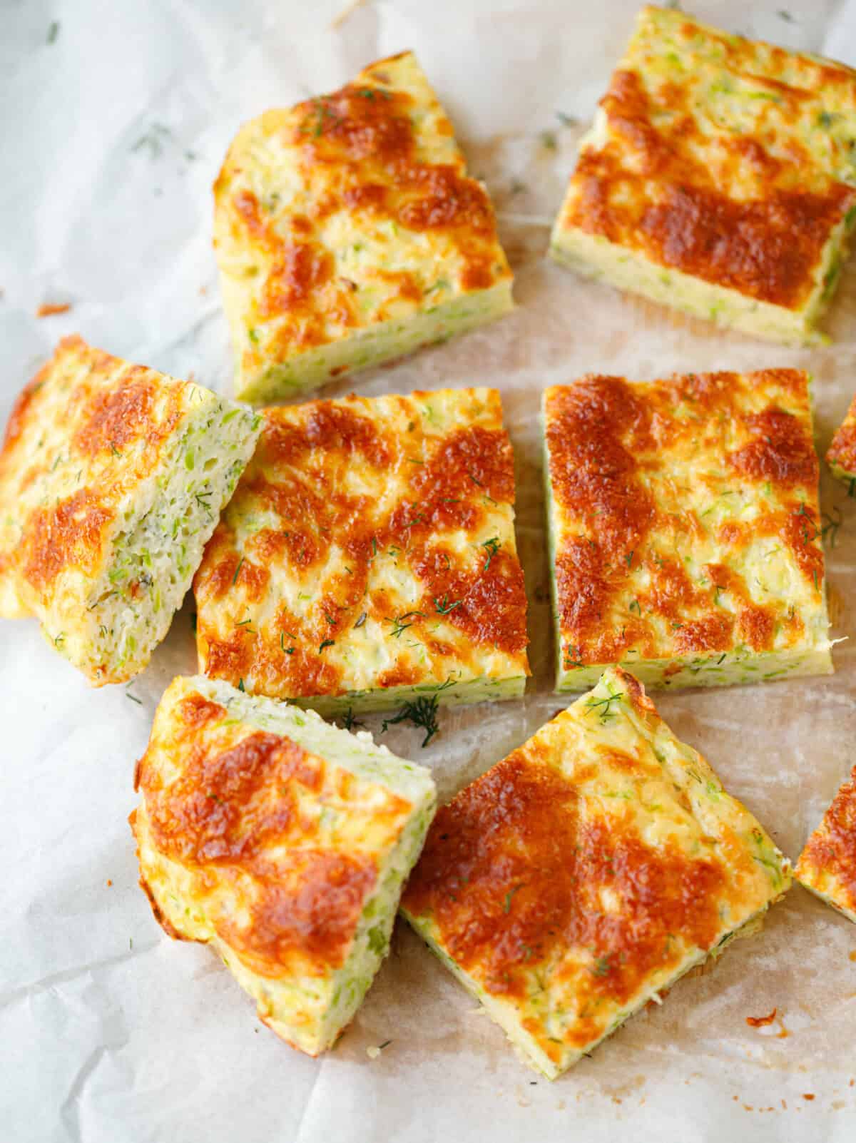 Zucchini frittata squares on parchment