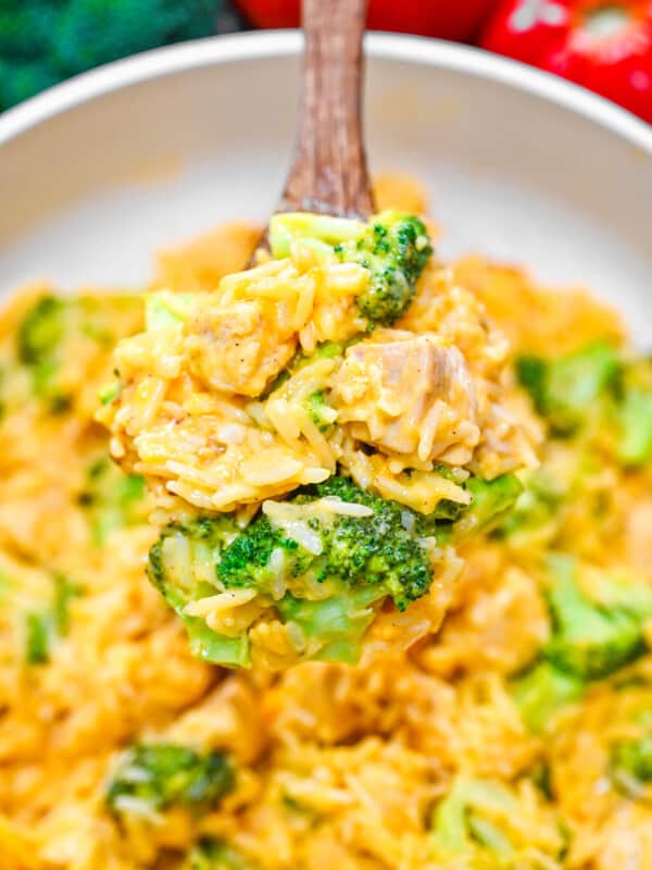 Creamy rice and broccoli chicken casserole with fresh parsley garnish