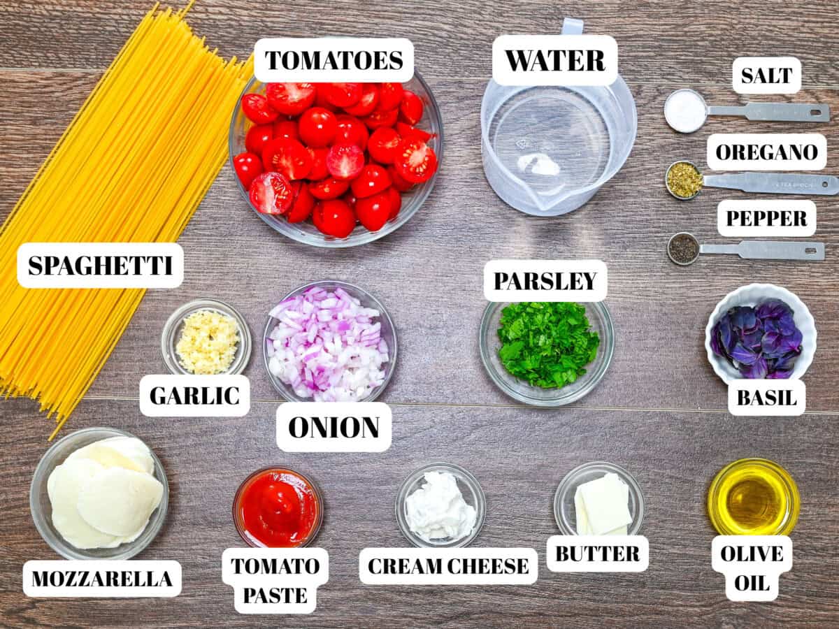 Clear glass bowls with ingredients for creamy cheese pasta.