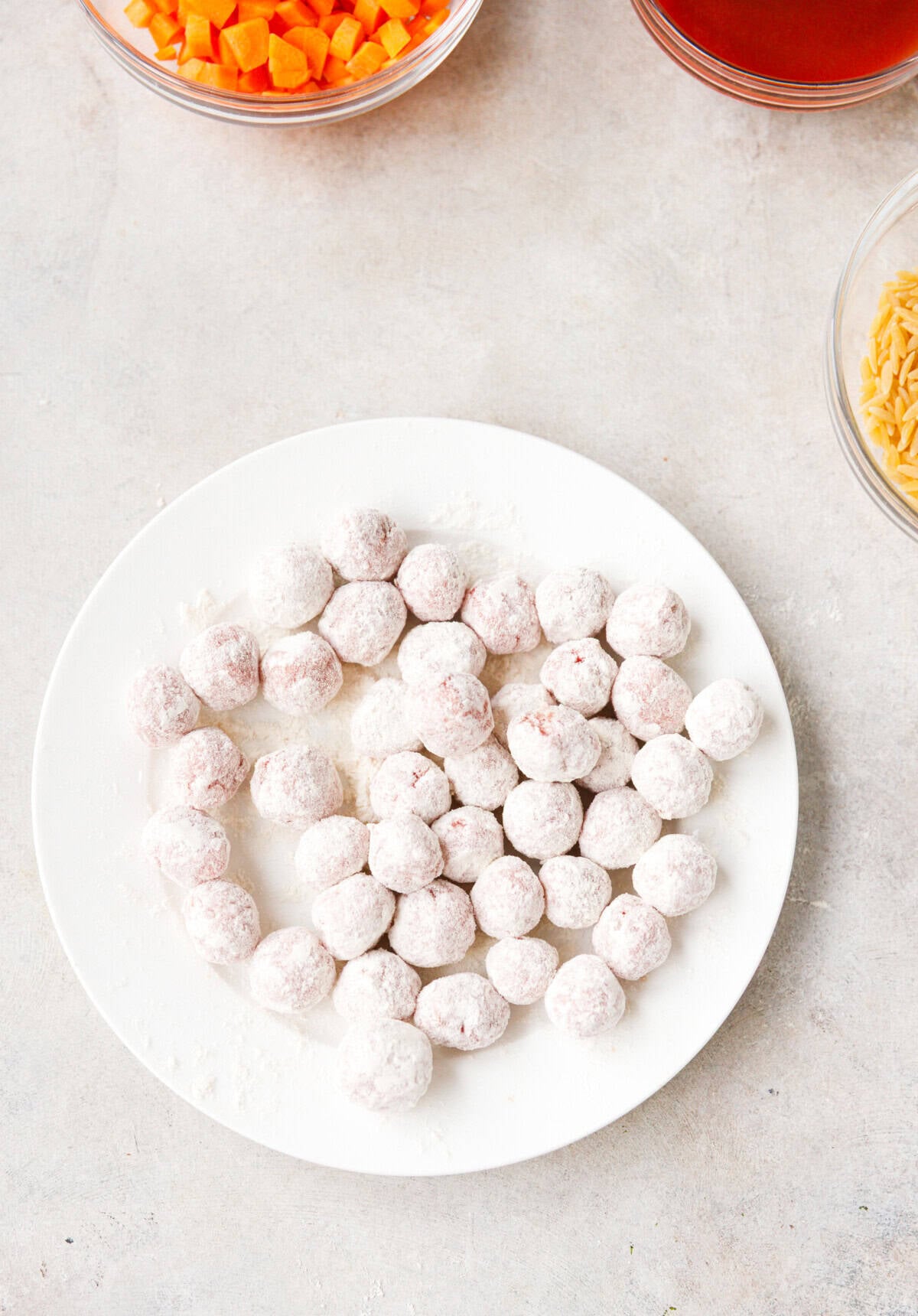 A plate with beef meatballs rolled in flour