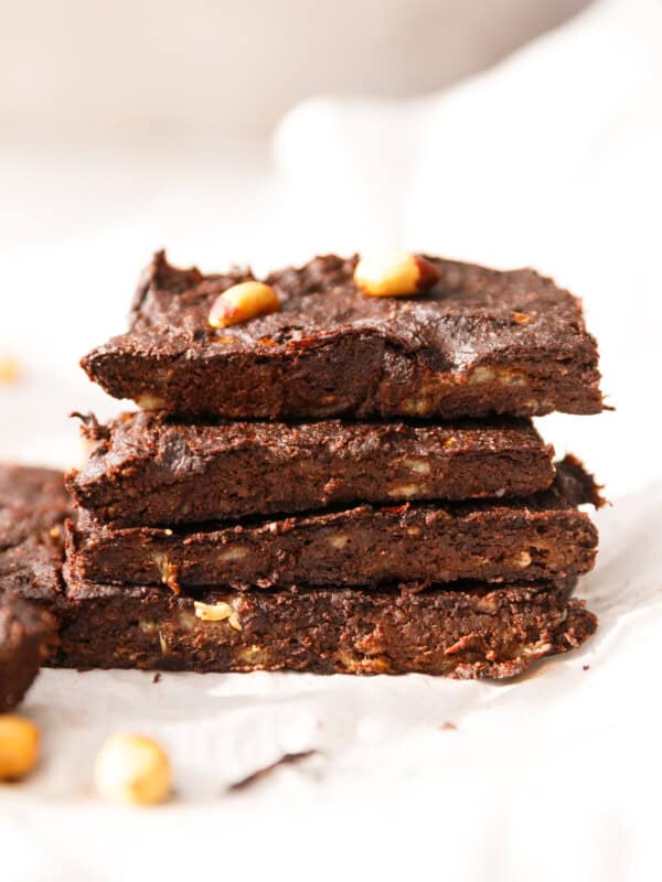 Slices of chocolate banana brownies stacked on top of each other