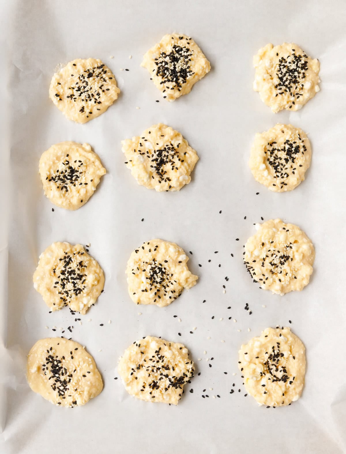 Low-carb cottage cheese flatbreads topped with sesame seeds before baking