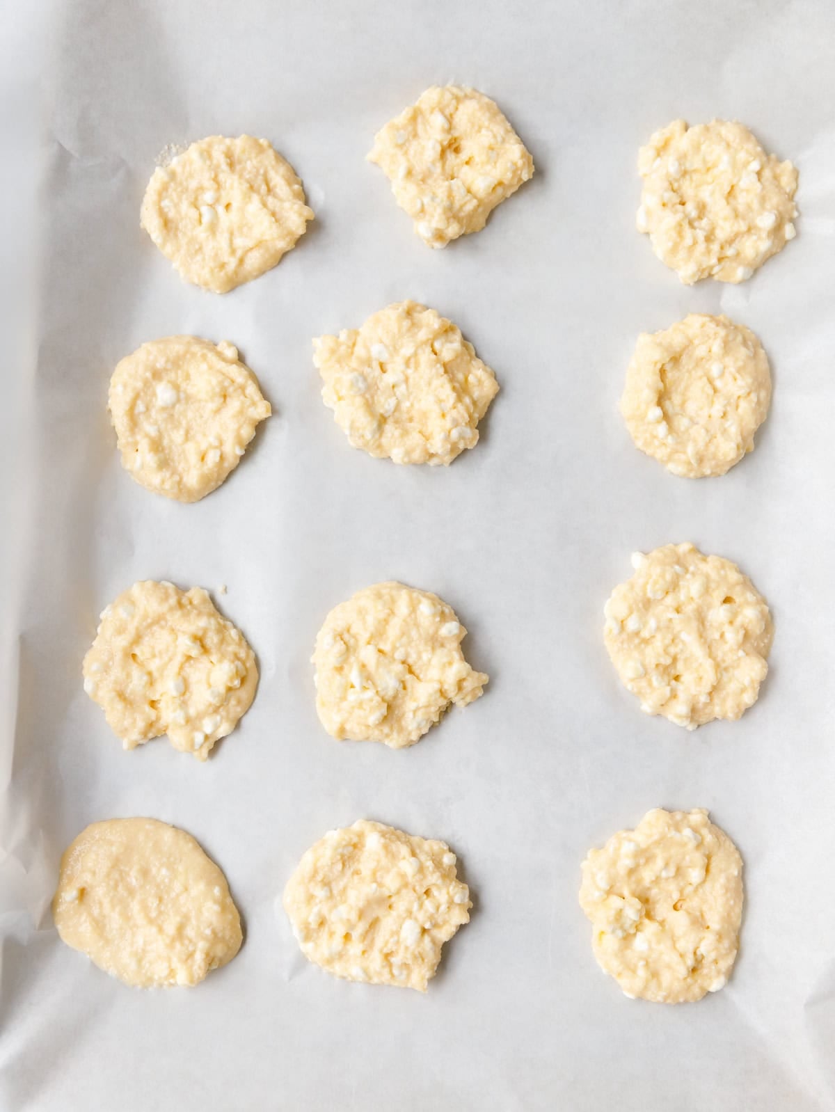 Low-carb cottage cheese flatbreads shaped and ready for baking