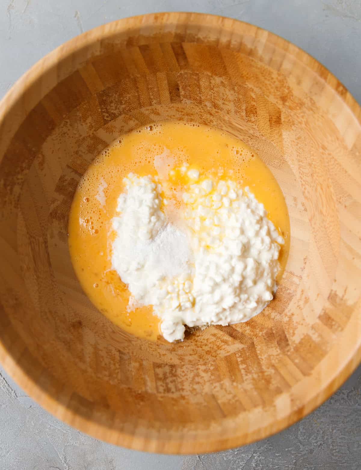 Eggs and cottage cheese combined in a bowl for low-carb flatbread batter