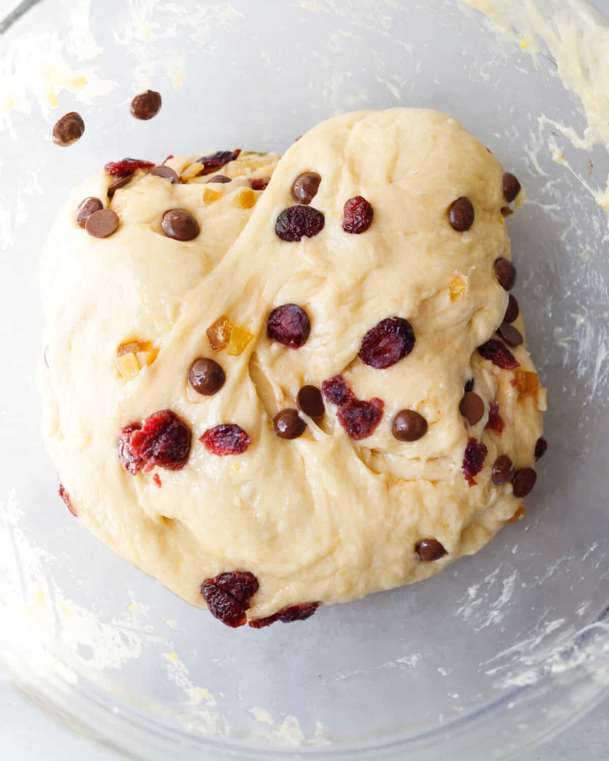 kulich dough with dried fruit and chocolate chips folded in after first rise