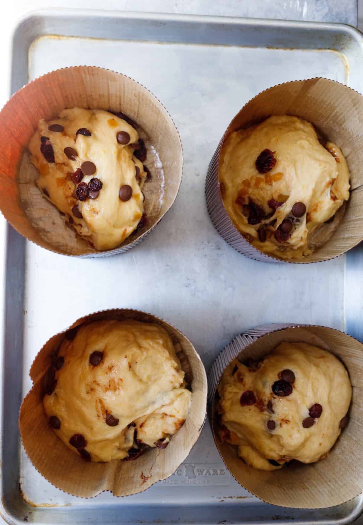 kulich dough placed into paper molds before second rise