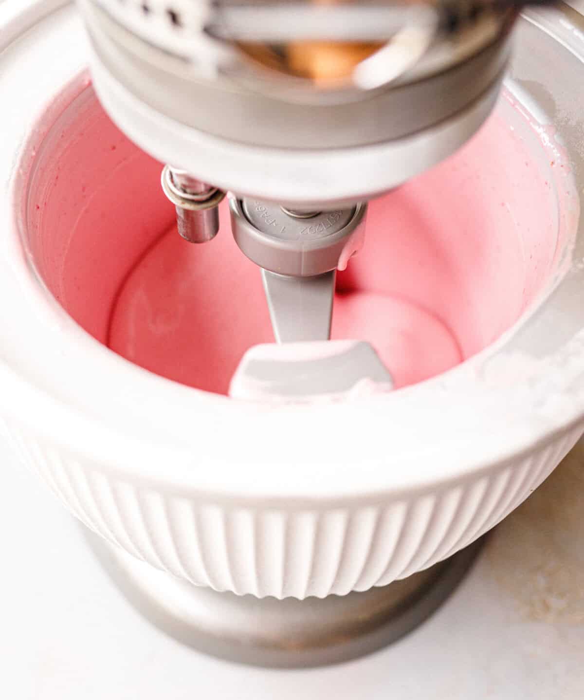 Raspberry mascarpone ice cream churning in a KitchenAid ice cream bowl attachment