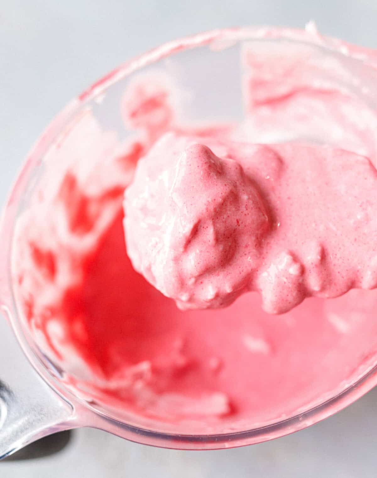Mascarpone folded into the strained raspberry base for low-carb ice cream