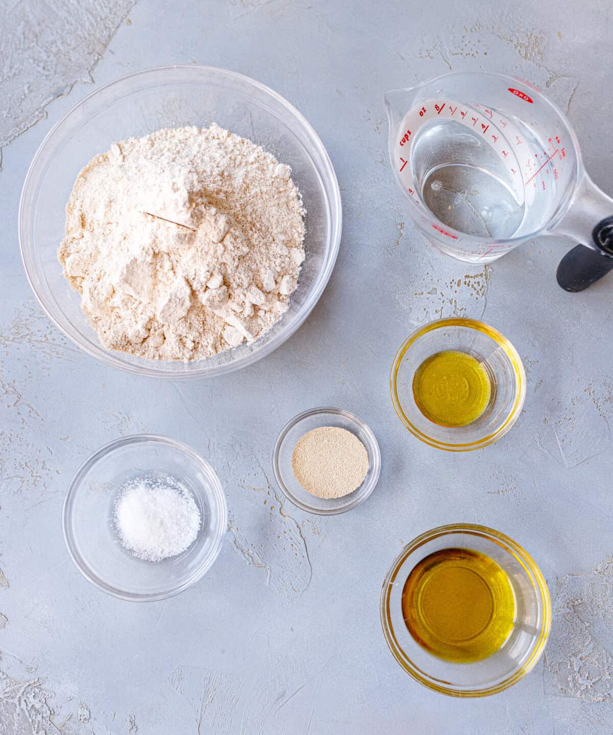 Ingredients for spelt focaccia: spelt flour, water, yeast, salt and olive oil